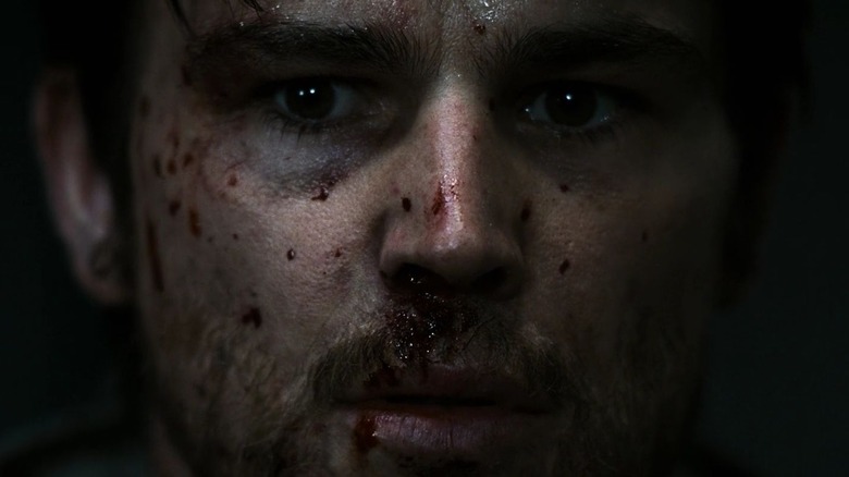 Josh Hartnett's Sheriff Eben Oleson is seen in extreme closeup with blood splatter on his face in 30 Days of Night