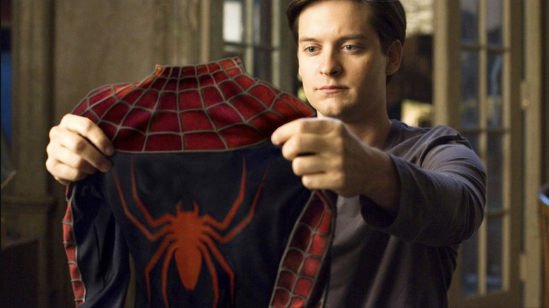 Tobey Maguire holdings his suit in Spider-Man 3