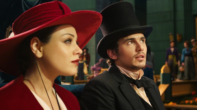 Mila Kunis as Theodora and James Franco as Oscar entering the Emerald City in Oz the Great and Powerful