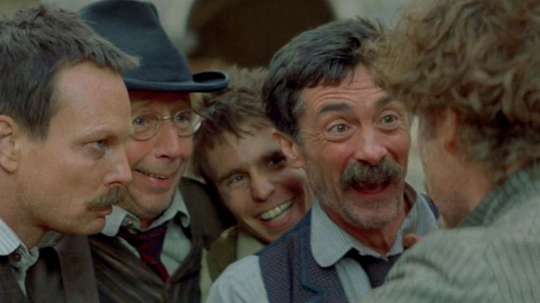 Quince in front of the other players in A Midsummer Night's Dream (1999)