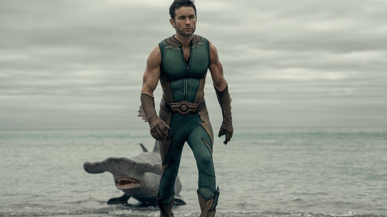 Chace Crawford as The Deep with Xander the shark behind him in The Boys