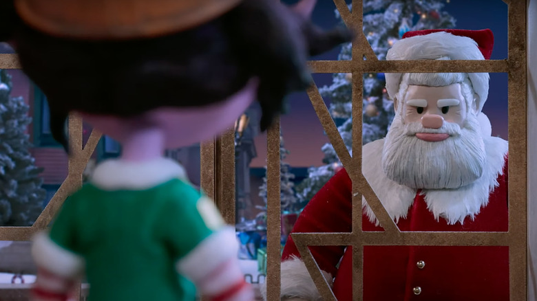 Santa looking angry in Candy's window in Santa, Inc.