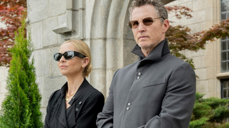 Ursula and Titus stand together in Ready or Not 2: Here I Come