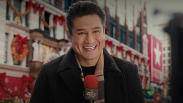 Marip Lopez as himself hosting the Thanksgiving Day Parade in Hacks