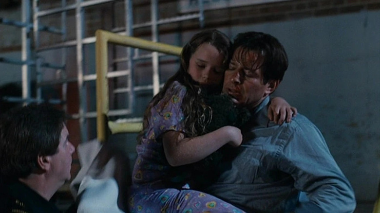 Costas Mandylor and Niamh Wilson in Saw V