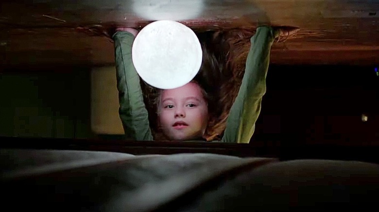 Vivien Lyra Blair as Sawyer, checking under her bed, in The Boogeyman