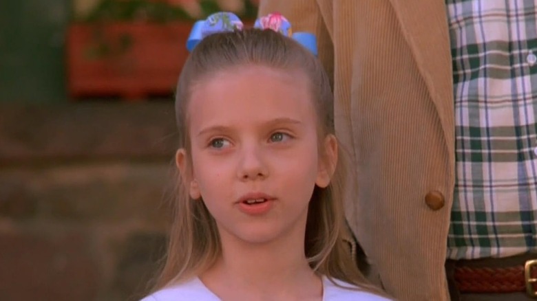 Scarlett Johansson as Laura wearing a bow in her hair in North