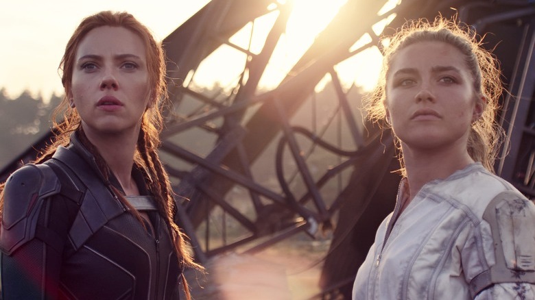 Scarlett Johansson Florence Pugh stand in front of ruins