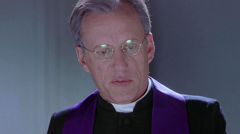 James Woods as Father McFeely wearing glasses in Scary Movie 2