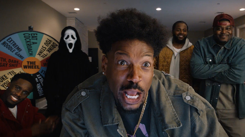 Shorty yelling at the camera with Kai Cenat, Ghostface, and other buddies behind him