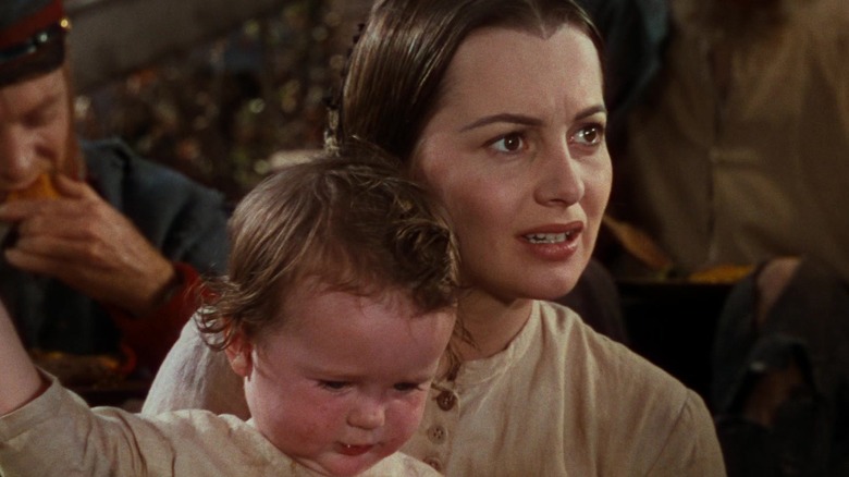 Miss Melanie with a young child in Gone with the Wind