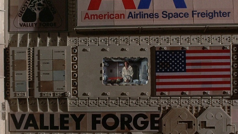 Lowell stares out the window of the Valley Forge spacecraft