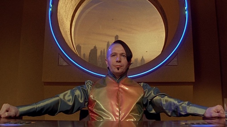Gary Oldman sitting at table