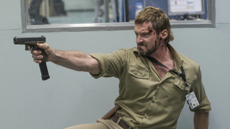 Hugh Jackman shooting gun