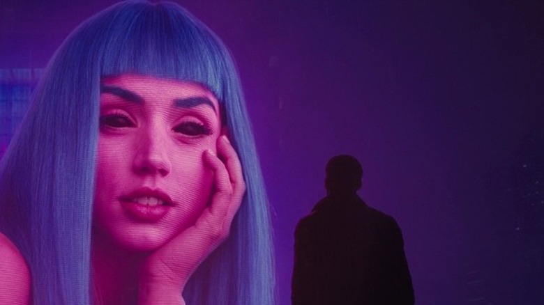 K looking at giant Joi hologram in Blade Runner 2049