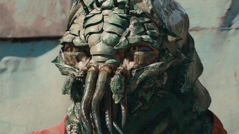 alien looks at the camera