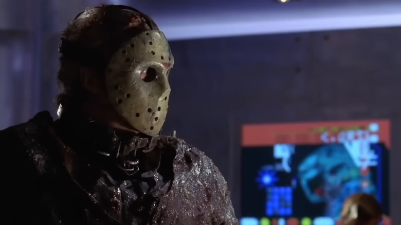 Jason X looking at a woman using a computer