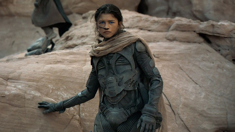 Chani (Zendaya) amidst rocks in Dune