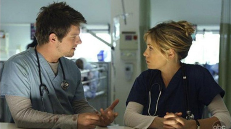 Characters talk in a hospital