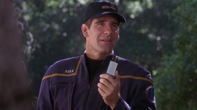 Captain Archer in a hat, holding a communicator on Star Trek: Enterprise