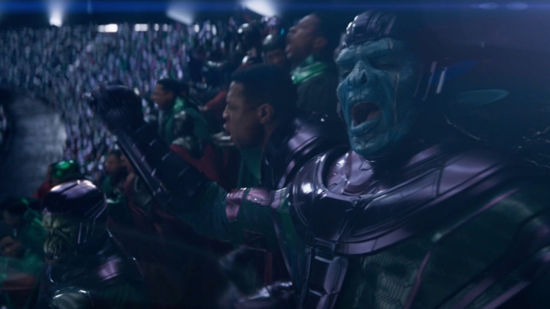 Jonathan Majors as several Kang variants in a crowded arena in the post-credits scene for Ant-Man and the Wasp: Quantumania