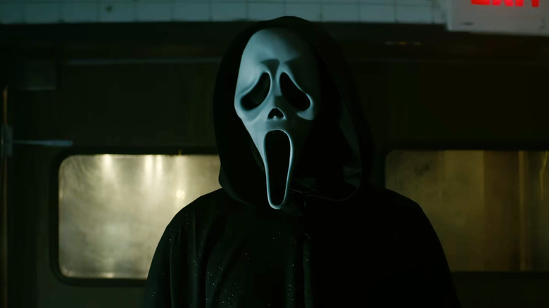 Ghostface standing in a dark room in Scream 7