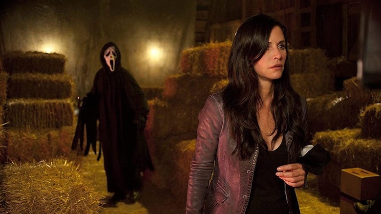 Ghostface and Courteney Cox in Scream (2022)