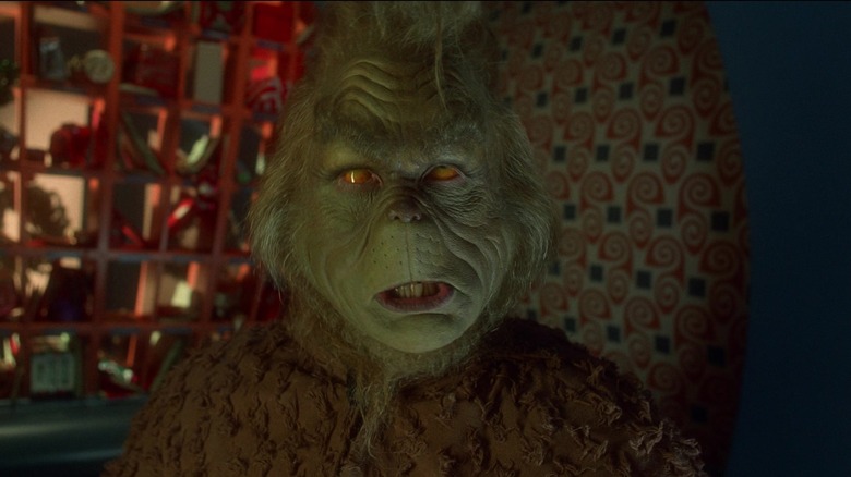 Jim Carrey's Grinch is seen in closeup with his eyes rolled back in his head in How the Grinch Stole Christmas.jpg.jpg