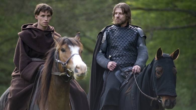 Eddie Redmayne as Osmund and Sean Bean as Ulric ride horses in Black Death