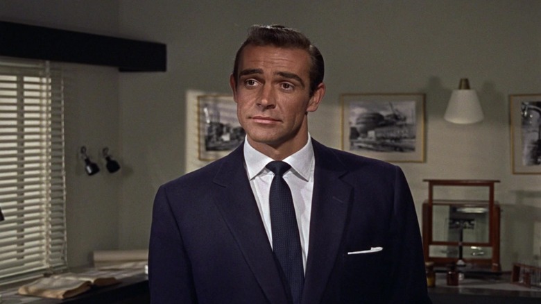 James Bond in an office in Dr. No, looking quizzically at someone off screen