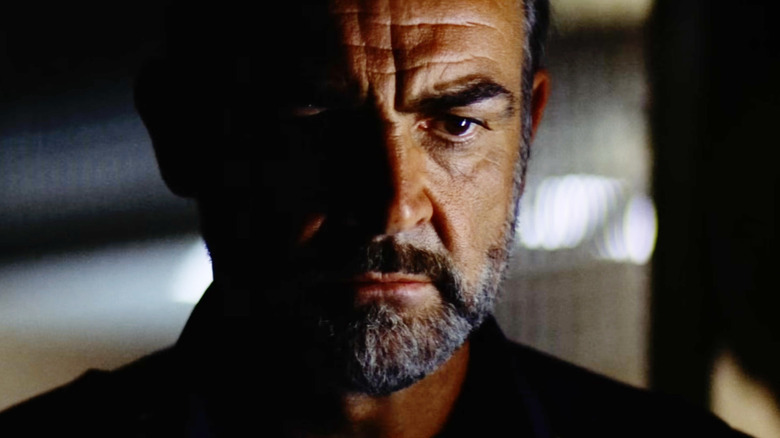 Sean Connery as William O'Niel standing in the shadows in Outland