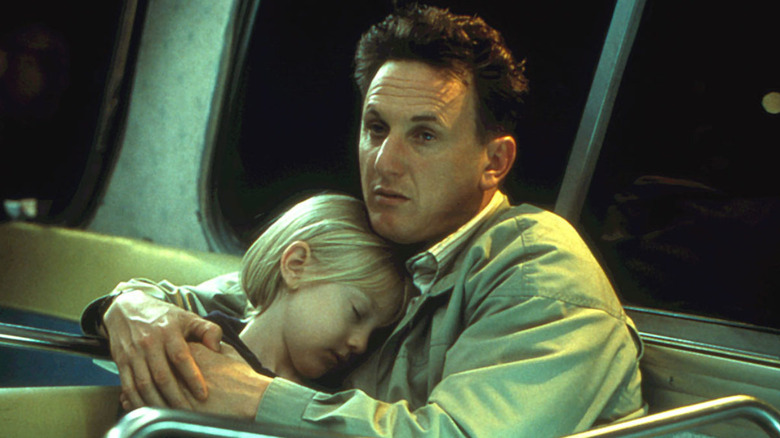 Sean Penn hugs Dakota Fanning