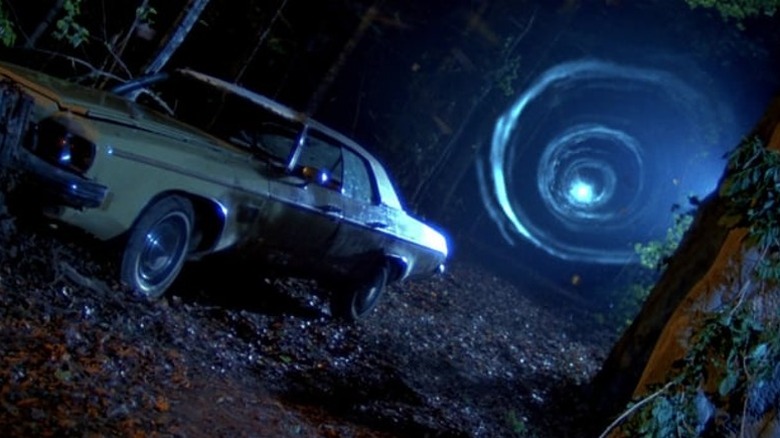 Ash's car and a portal