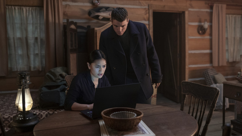 The Night Agent Rose and Peter looking at laptop screen