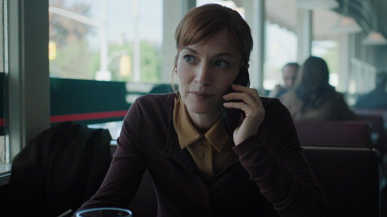 Britt Lower as Rachel Mills on her phone in a diner in I Will Find You