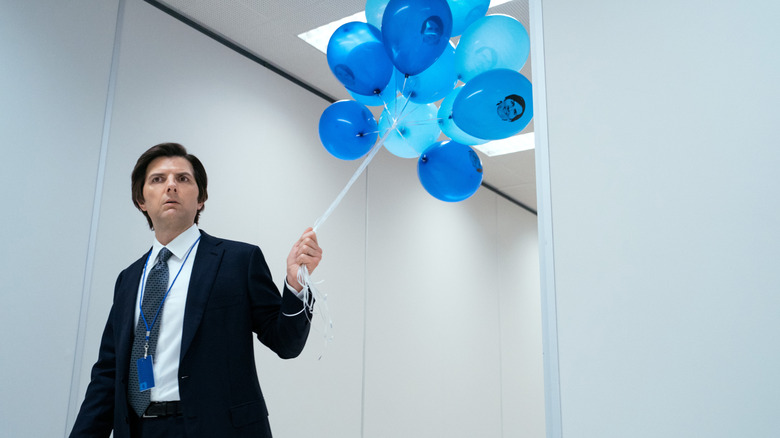 Mark S. holding balloons in the Lumon hallway on Severance