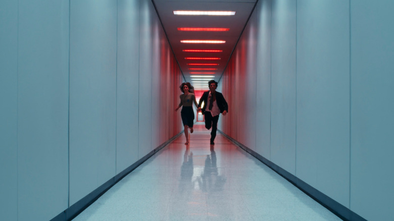 Mark S. and Helly R. running down the red hallway in Severance