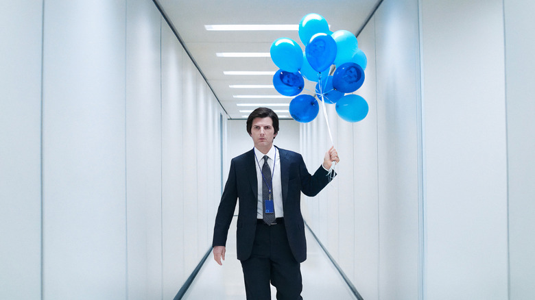 Mark S. holding balloons in the Lumon hallway in Severance
