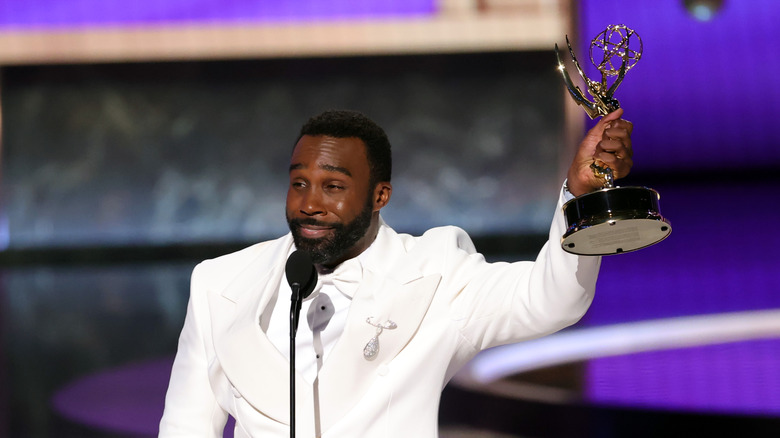 Tramell Tillman holding up his Emmy during his acceptance speech