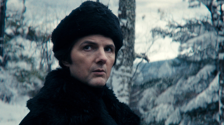 Mark S. Standing in a snow forest in a chapter