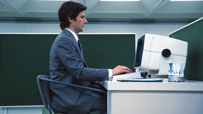 Mark S. hard at work at a computer on Severance