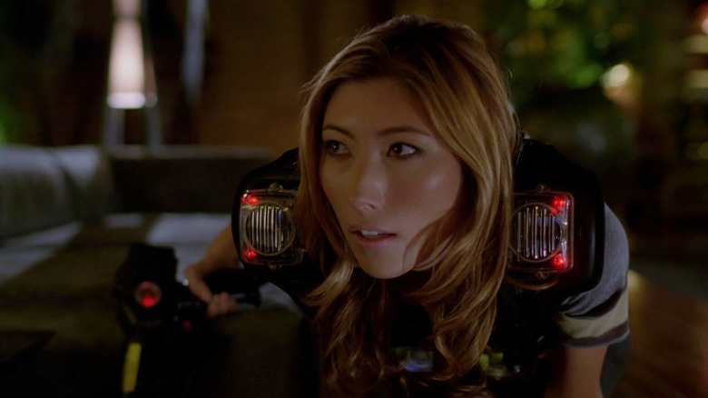Dichen Lachman as Sierra holding a gun in Dollhouse