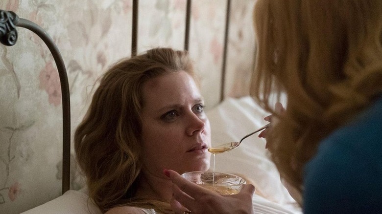 Camille taking syrup from Adora on Sharp Objects