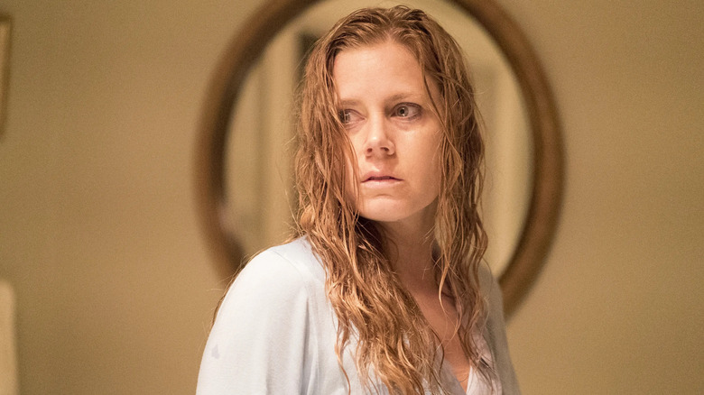 Camille with wet hair looking horrified on Sharp Objects