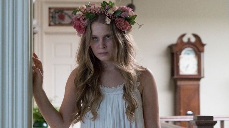 Amma looking sick in a white nightgown and flower crown in Sharp Objects