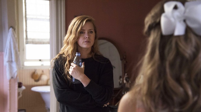 Amy Adams holding bottle in Sharp Objects