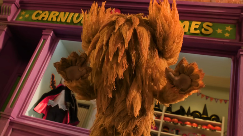 The titular Beast scaring some villagers in Shaun The Sheep: The Beast Of Mossy Bottom