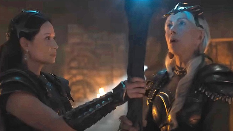 Kalypso and Hespera holding staff