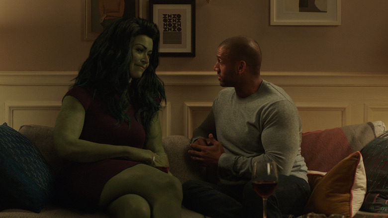 She-Hulk sitting on couch with man