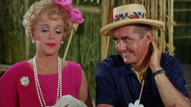 The Howells at a table on Gilligan's Island.